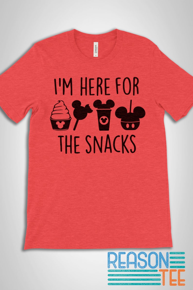 May include: Red t-shirt with the text "I'm here for the snacks" and a row of black Mickey Mouse-themed snacks including a Mickey Mouse ice cream cone, Mickey Mouse lollipop, Mickey Mouse coffee cup, and Mickey Mouse pretzel.