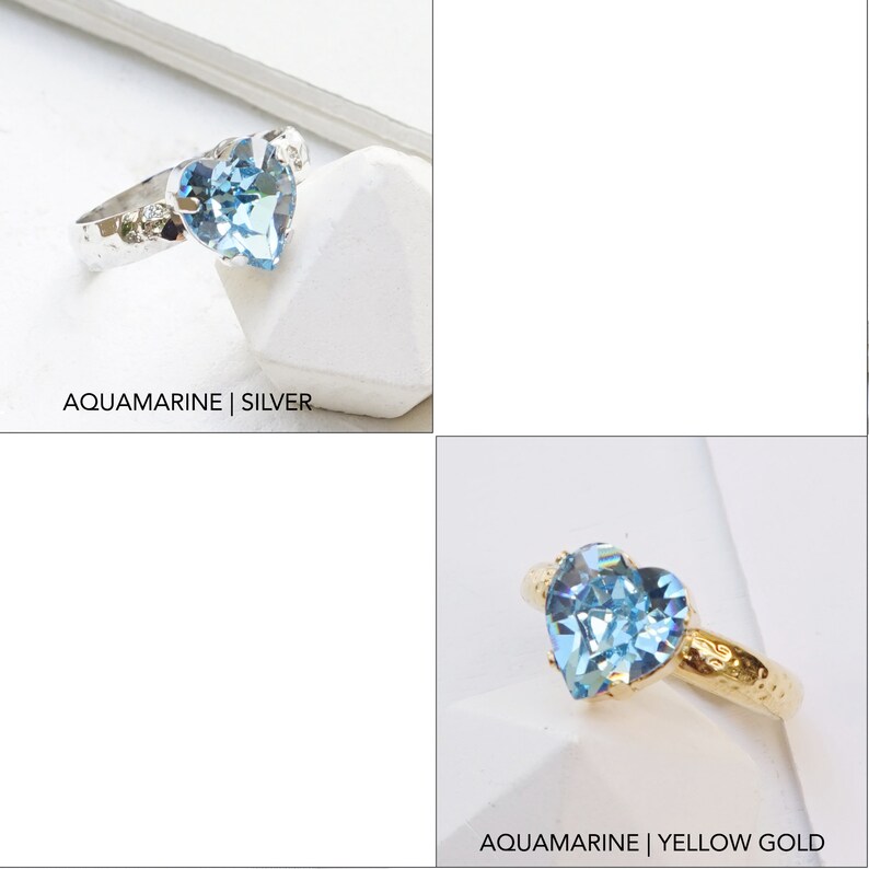 May include: Two rings featuring a heart-shaped light blue aquamarine crystal. One ring has a silver band with a hammered texture, and the other has a yellow gold band with a hammered texture. The text AQUAMARINE | SILVER and AQUAMARINE | YELLOW GOLD appears.