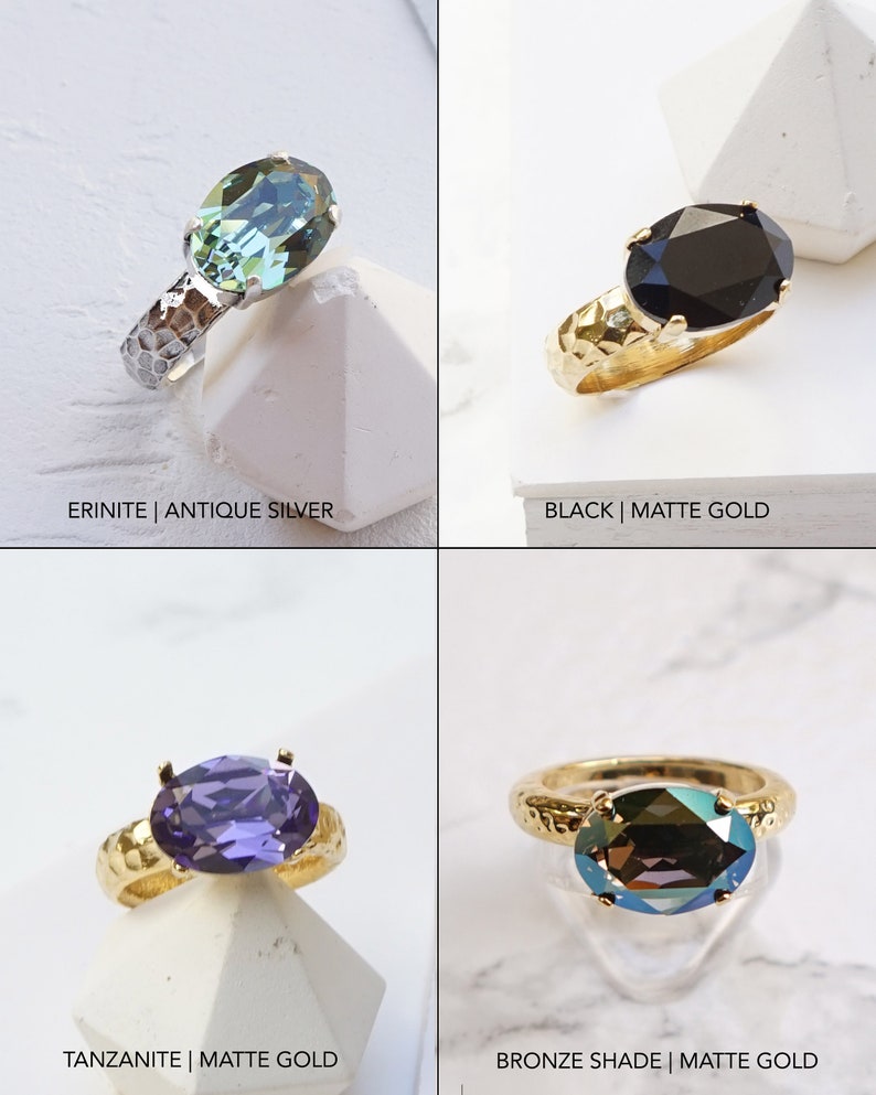 May include: Four rings with oval-cut faceted stones. Top left: Erinite stone with antique silver hammered band. Top right: Black stone with matte gold hammered band. Bottom left: Tanzanite stone with matte gold band. Bottom right: Bronze shade stone with matte gold band.