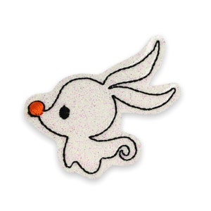 May include: A white, glittery Zero patch from The Nightmare Before Christmas. The patch features Zero's ghost dog design with black outline, orange nose, and black eye. The patch is an embroidered applique.