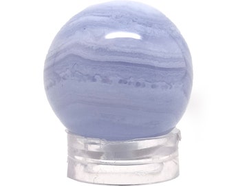 May include: A blue agate sphere with white and light blue banding. The sphere is sitting on a clear plastic stand.