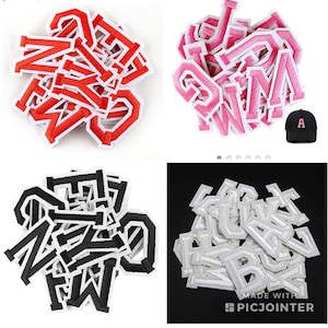 May include: Assortment of iron-on letters in red, pink, black, and white. The letters are in a variety of fonts and sizes. The letters are perfect for adding a personal touch to clothing, bags, and other items.
