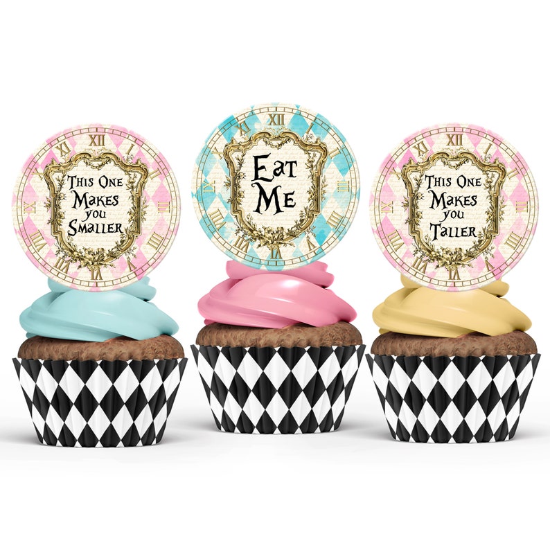 May include: Three cupcakes with different colored frosting and topped with round edible paper decorations. The decorations feature a clock face with the text "This One Makes You Smaller", "Eat Me", and "This One Makes You Taller".