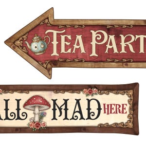May include: Wooden signs with a whimsical design. The top sign is an arrow pointing left, with the words "TEA PARTY" and a teapot illustration. The bottom sign reads "WE'RE ALL MAD HERE" with a mushroom illustration and floral accents.