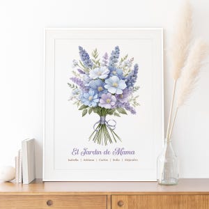 May include: A framed floral print featuring a watercolor bouquet of blue, lavender, and white flowers. The bouquet is tied with a ribbon. The text "El Jardin de Mama" is below the bouquet, with names underneath.