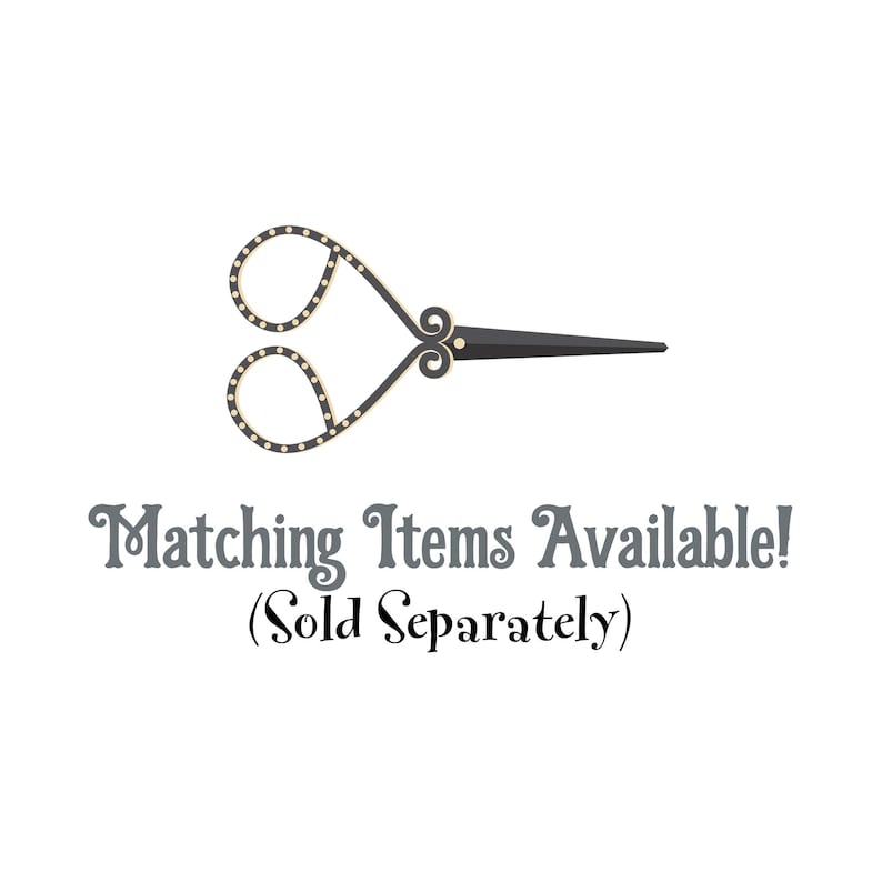 May include: Decorative scissors with a black handle and ornate gold-colored loops. The loops are dotted with small white circles. The text "Matching Items Available! (Sold Separately)" is below the scissors.