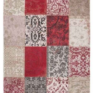 May include: A patchwork rug featuring a mix of patterns and colours, including red, beige, and cream. The rug is composed of squares of different fabrics, each with a unique design.