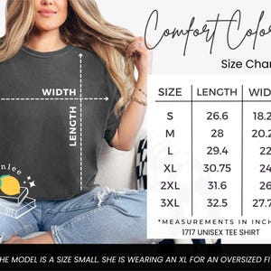 May include: A dark gray unisex tee shirt with a size chart. The chart shows measurements in inches for sizes S to 3XL. The model is wearing an XL for an oversized fit. The shirt is a 1717 unisex tee shirt.