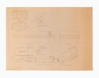 May include: A technical drawing of a bed frame with detailed measurements and instructions. The drawing is in red ink on a beige paper background.