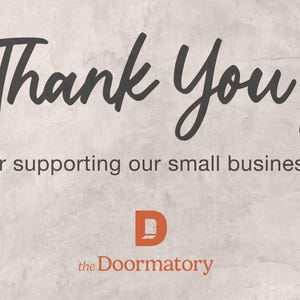a message that reads "Thank You! for supporting our small business!" The text is written in a casual, handwritten style. The image also features the logo of a company called "the Doormatory".