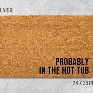 A large rectangular doormat with the text "Probably in the hot tub" printed on it.
