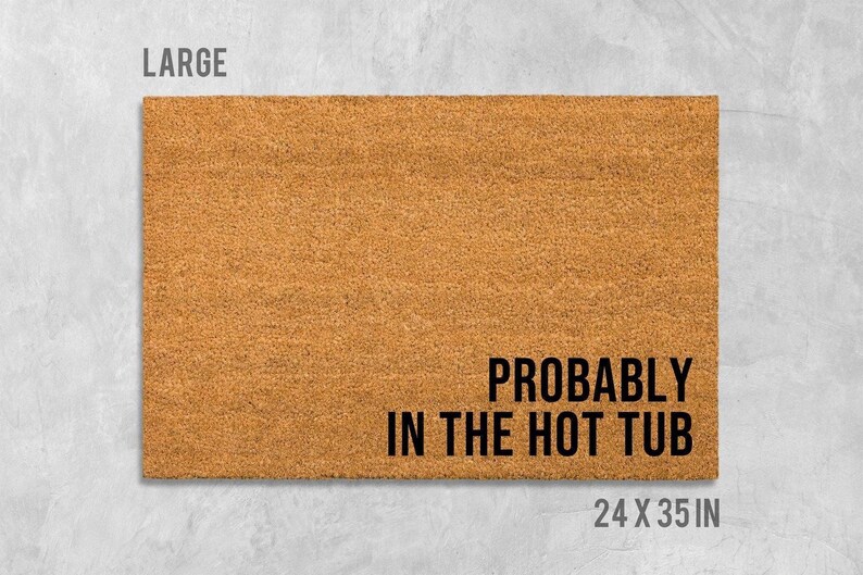 A large rectangular doormat with the text "Probably in the hot tub" printed on it.