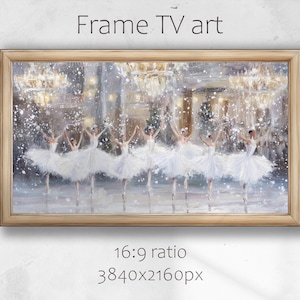 May include: A framed digital art print for a TV screen. The artwork depicts a ballet scene with ballerinas in white tutus and tiaras, set against a snowy, illuminated backdrop. The frame is a light wood color, and the text "Frame TV art" is at the top.