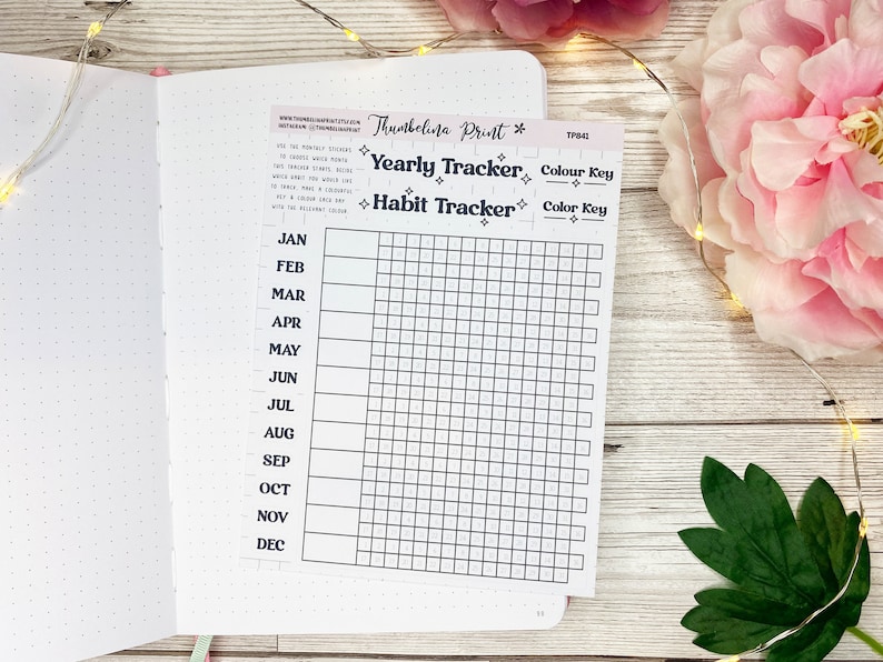 May include: A black and white printable habit tracker with a grid for each month of the year. The tracker is labeled "Yearly Tracker" and "Habit Tracker".