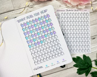 May include: A book tracker page with a grid of 100 book icons. The icons are colored in a gradient of purple, blue, and green. The page also includes a key with the categories: mystery, thriller, crime, and romance.