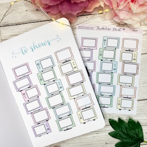 May include: A printable sheet of stickers featuring a retro television design. The stickers are in pastel colors and are perfect for adding a touch of whimsy to your planner or journal. The sheet includes the text "Thumbleina Print #" and "TP1375".