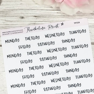 May include: A sheet of white sticker paper with black handwritten days of the week. The days of the week are repeated multiple times on the sheet. The text "Thumbelina Print *" and "TP729" are printed in the top right corner of the sheet.