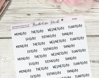 May include: A sheet of white sticker paper with black handwritten days of the week. The days of the week are repeated multiple times on the sheet. The text "Thumbelina Print *" and "TP729" are printed in the top right corner of the sheet.