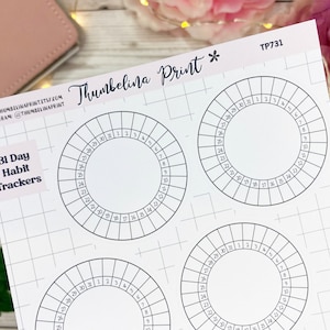 May include: Four printable 31-day habit trackers. Each tracker is a circle divided into 31 sections, numbered 1 through 31. The trackers are on a white sheet of paper with a grid pattern. The text "31 Day Habit Trackers" is printed in black at the top of the sheet.