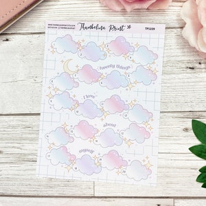 May include: A sheet of twenty cloud-shaped stickers with gold stars. Each cloud has a number and a space to write. The text "I love twenty things about myself" is printed on the sheet.