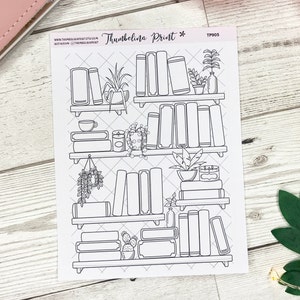 May include: Black and white printable sticker sheet with a design of a bookshelf with books, plants, and other decorative items. The sheet is labeled "Thumbelina Print*" and "TP905".