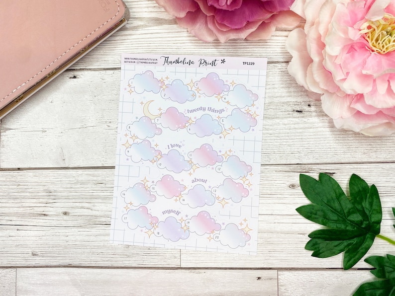 May include: A sheet of 20 cloud-shaped stickers with a pastel pink and blue ombre design. Each cloud has a gold star and a number. The text "Twenty Things" is written on one cloud, "I love" on another, "about" on another, and "myself" on another.