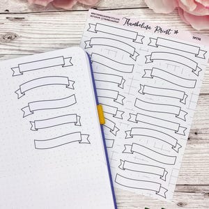 May include: A sheet of black and white printable planner stickers featuring banner shapes. The sheet is labelled "Thumbelina Print" and "TP774".