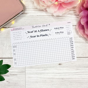 May include: A printable year at a glance and year in pixels planner with a colour key. The planner has a grid with 12 columns for each month of the year and 31 rows for each day of the month.