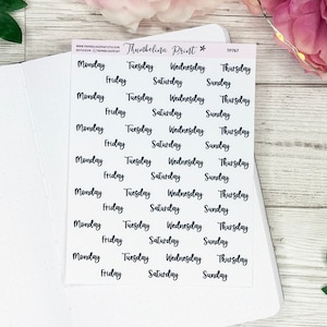 May include: A sheet of clear stickers with black handwritten text. The stickers feature the days of the week: Monday, Tuesday, Wednesday, Thursday, Friday, Saturday, and Sunday.