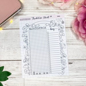 May include: A printable planner page with a floral border and a gridded section for tracking habits or goals. The page also includes a key section for labeling the grid squares. The text "Thumbelina Print" and "key" are visible on the page.
