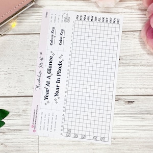 May include: A printable year at a glance planner with a grid for each month and a colour key. The planner is designed to be used with a pixel art style.