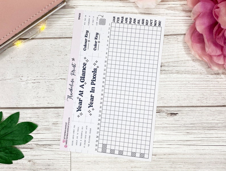 May include: A printable year at a glance planner with a grid for each month and a colour key. The planner is designed to be used with a pixel art style.