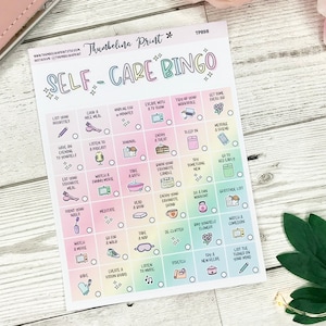 May include: A Self-Care Bingo card with a pastel rainbow gradient background. The card features a grid of boxes, each with a self-care activity such as "Cook a nice meal," "Listen to a podcast," and "Go to bed early." The card is designed to encourage self-care.