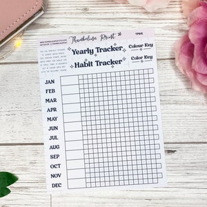 May include: A printable habit tracker with a grid for each month of the year. The tracker is labeled "Yearly Tracker" and "Habit Tracker" with a color key section.