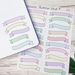 May include: A sheet of pastel colored banner stickers with the text "Thumbelina Print * TP775" at the top. The banners are in various pastel colors, including pink, blue, green, yellow, and purple.