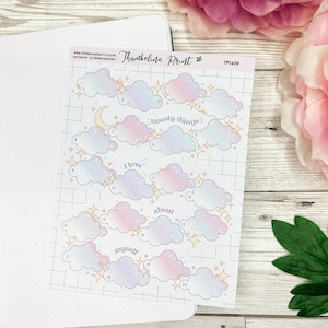 May include: A sheet of twenty cloud-shaped stickers with a pastel pink and blue ombre design. Each cloud has a number and a gold star. The text "I love twenty things about myself" is printed on the sheet.