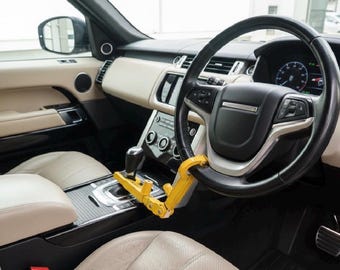 Steering Wheel Lock. Strong unique Double Lock for Automatic Vehicles. Nunchuck Style Folds for safe storage.