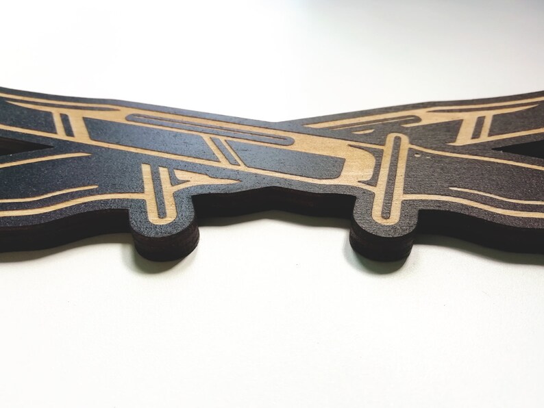 May include: A wooden cutout of a plane in a dark brown color with a light brown outline.