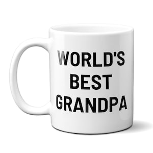 May include: White ceramic coffee mug with black text that reads "WORLD'S BEST GRANDPA".