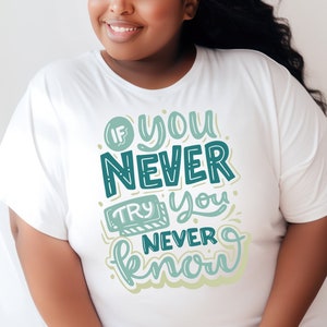 May include: White t-shirt with a teal and green graphic that says "If you never try you never know."