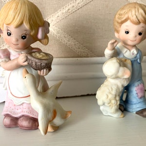 Homco 1449 Set of Two Porcelain Figures in Overalls Feeding Baby Farm Animals 0827