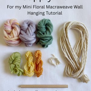 May include: A supply kit for a mini floral macraweave wall hanging tutorial, featuring six small bundles of yarn in pink, lavender, green, light green, yellow, and orange, a coil of white cord, a long beige cord, and a wooden dowel rod.