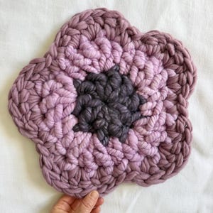 May include: A set of three ceramic mugs with a speckled, matte finish. The mugs are in shades of cream, light gray, and dark gray. Each mug has a simple, minimalist design, perfect for coffee or tea.