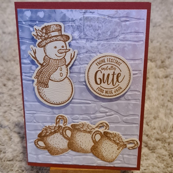 Weihnachtskarte mit Schneemann , heiße Schokolade