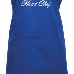 May include: A blue apron with a white chef's hat and the text "JASON Head Chef!" printed on it.