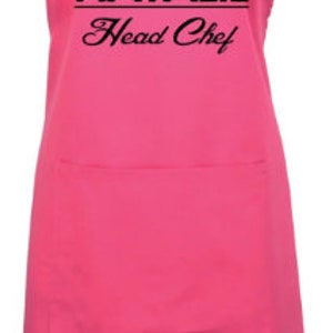 May include: Pink apron with a black chef hat graphic and the text "Natalie Head Chef".