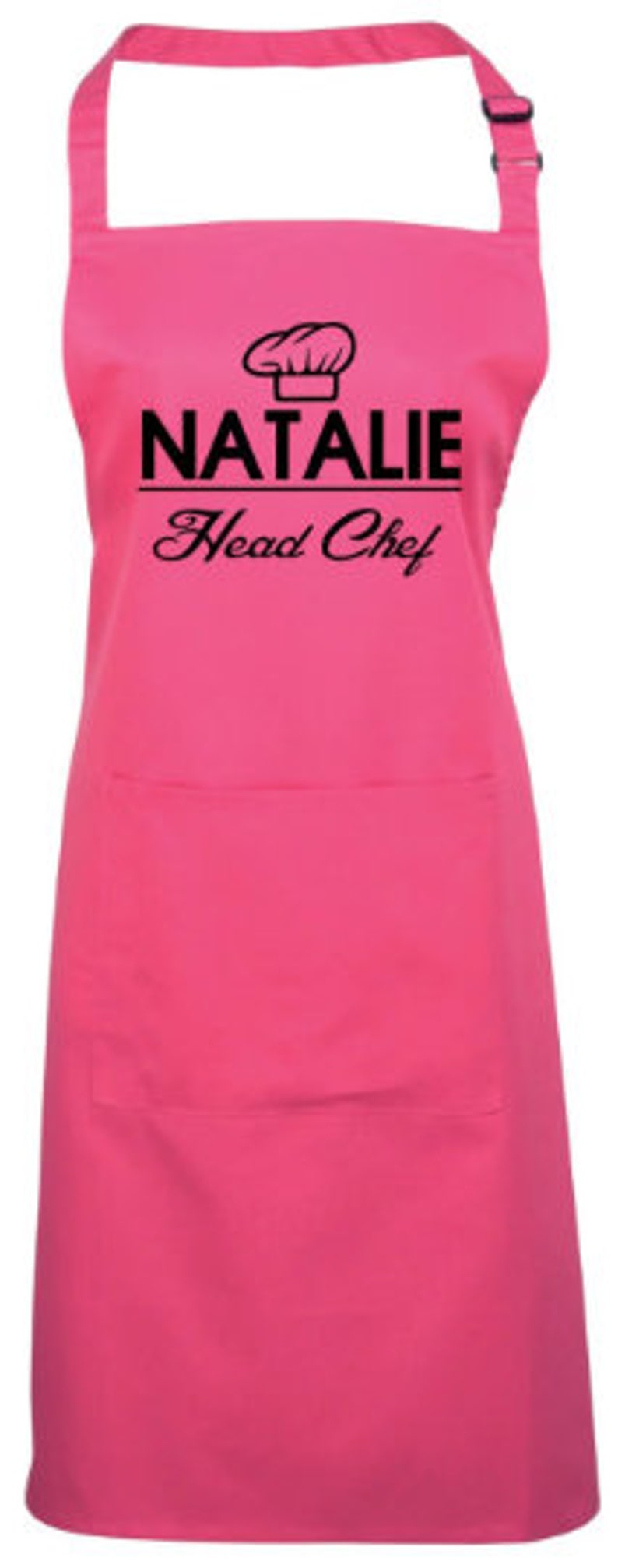 May include: Pink apron with a black chef hat graphic and the text "Natalie Head Chef".