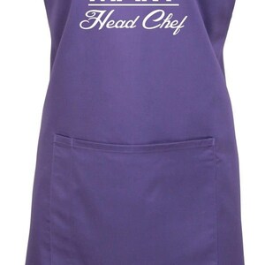 May include: Purple apron with a white chef hat and the text "MARY Head Chef".