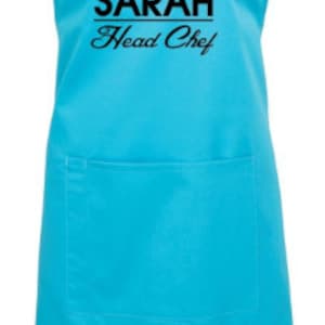May include: A turquoise blue apron with a black chef's hat graphic and the text "SARAH Head Chef".