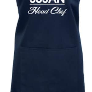 May include: A navy blue apron with a white chef hat graphic and the text "SUSAN Head Chef".